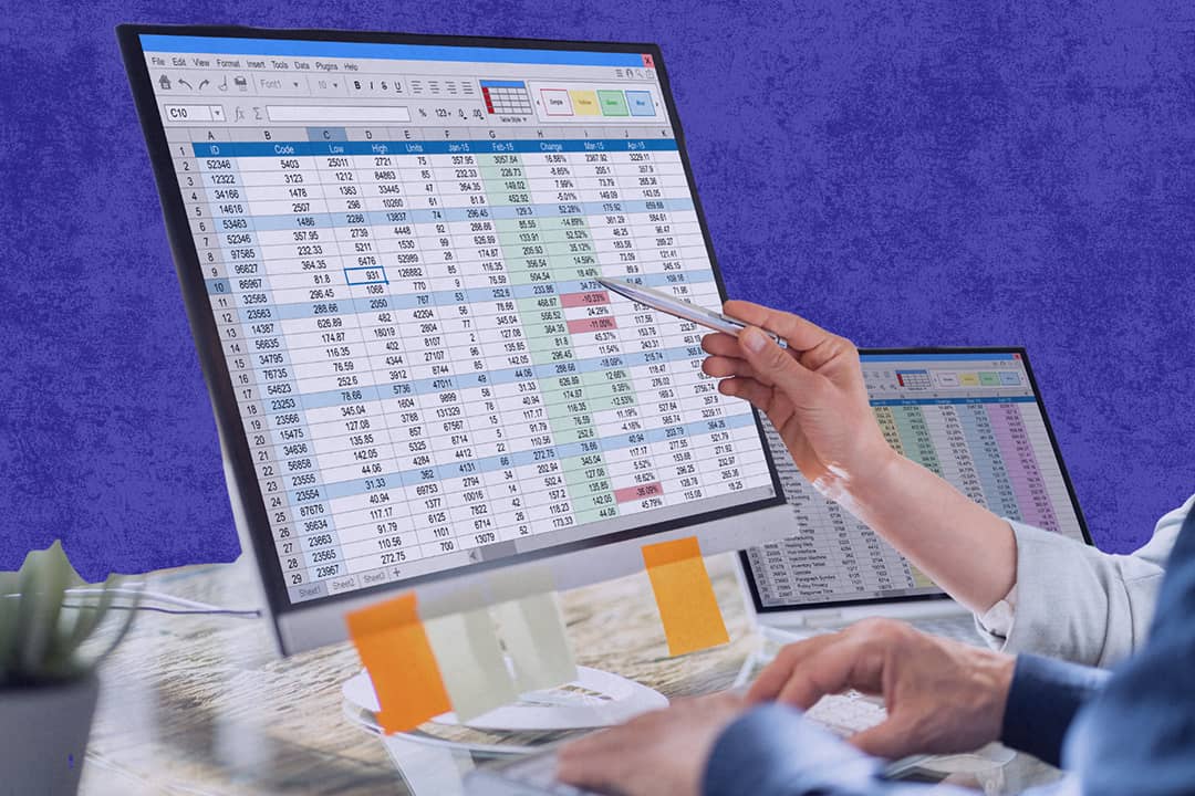 Analysts reviewing spreadsheets from separate monitors for financial tracking and data management tasks.